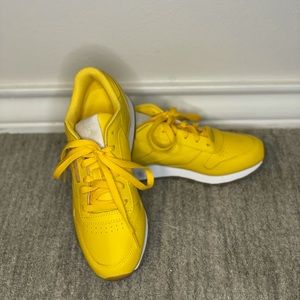 Yellow Reebok shoes